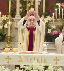 Monsignor Andrew Cassin, assistant at St. Francis, celebrating Mass during the Easter season