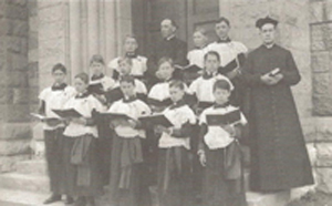Father Joseph Frioli and his all-male choir