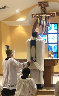 John Paul serving Mass at his home parish with Fr. Mark White