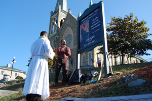 Blessing of the sign for Mary's House at St. Francis