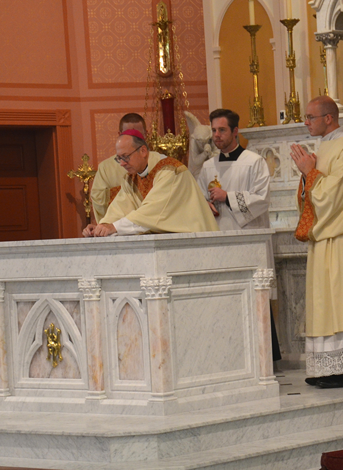 Bishop Knestout consecrates the altar with sacred chrism